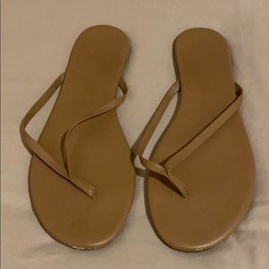 Nude fashion flip flops